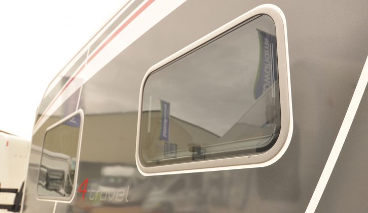 The flush-fitting framed side windows add to this motorhome's premium appeal and sleek looks