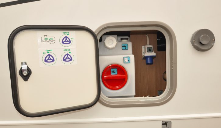 This clever small locker and hatch allows for all-in-one access to the fresh-water tank, the boiler and the electric hook-up point