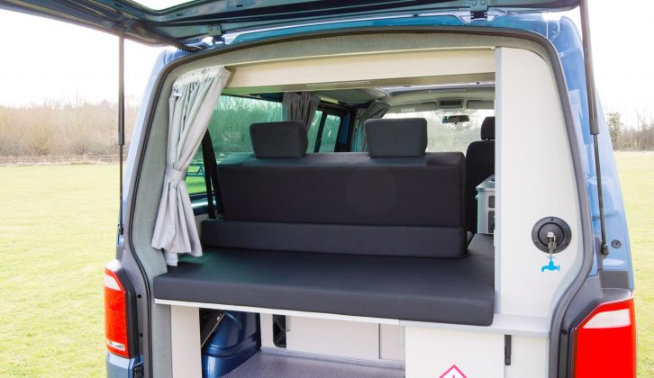 Lift the VW campervan's tailgate and you’ll see the filler for the freshwater tank, an easy-access gas locker, a large loading bay for luggage, and space for a portable toilet