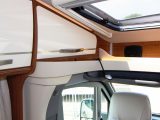 Despite the streamlined low-profile overcab of the ML-T 630, Hymer squeezed in a panoramic skylight, two lockers and a lipped shelf