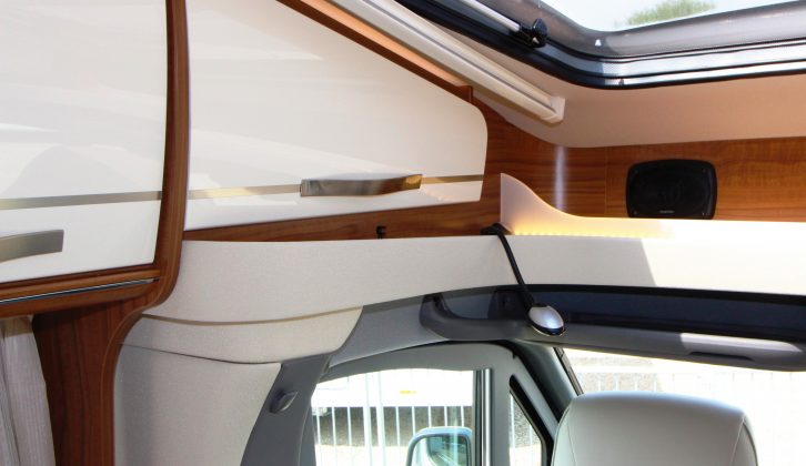 Despite the streamlined low-profile overcab of the ML-T 630, Hymer squeezed in a panoramic skylight, two lockers and a lipped shelf