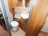 An offside tambour door opens to reveal a washroom with a toilet, a vanity unit, a sink and plenty of storage, but a window would be nice