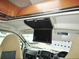 The Auto-Trail's streamlined overcab contains locker space, while the Media Pack includes a rear-view camera and a TV/DVD player