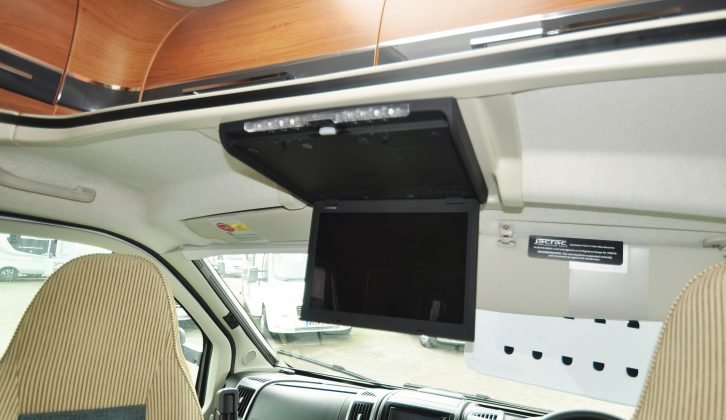 The Auto-Trail's streamlined overcab contains locker space, while the Media Pack includes a rear-view camera and a TV/DVD player