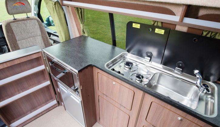 This classic campervan kitchen gives you a deep sink and a two-ring gas hob, as well as the fridge and oven/grill