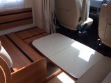 The telescopic lounge table lowers to provide the base for the occasional third berth