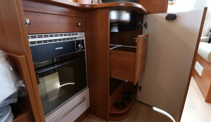 A combination oven and grill is fitted as part of Rapido’s UK Pack, while storage options include receivers for wine bottles