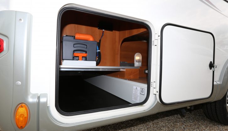 Offside corner storage space in the Rapido 665F offers easy access to the electric-flush toilet’s cassette, as well as to the under-bed storage – on the right