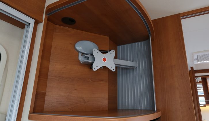The locker above the fridge/freezer houses a bracket for a flatscreen TV, that allows viewing from the front or rear of the vehicle