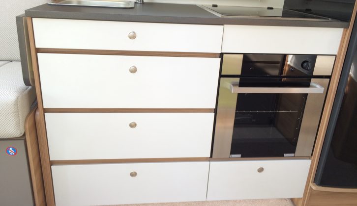 Brilliant white drawers provide a healthy amount of space for your cooking kit – and there's a worktop extension flap