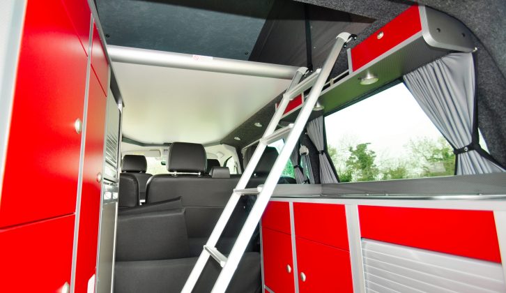 The unwieldy ladder to the upper bed is less than ideal, but the rear offers a wealth of places to stow clothes, kitchen gear, food and other touring essentials