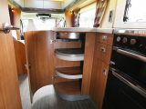 The space vacated by the fridge that permitted the insertion of the L-shaped kitchen unit means the addition of handy storage options under the worktop