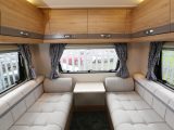 Rear lounges are popular with British buyers and this well-lit space with a handy flap-up table is very welcoming