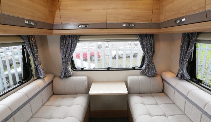 Rear lounges are popular with British buyers and this well-lit space with a handy flap-up table is very welcoming