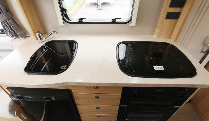 The black sink sits over an 85-litre fridge, which could be a little small for parties of six