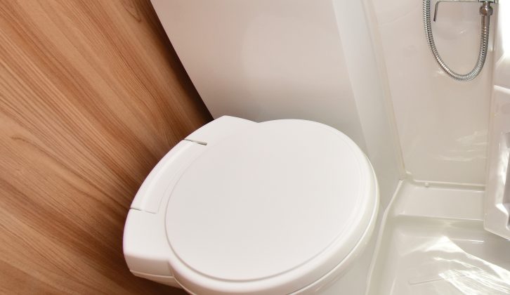 When not in use, swivel the toilet to permit easier access to the shower area