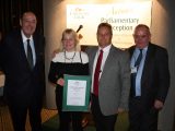 Ann and Bruce Regimbal receive their certificate after Caravan Club members voted Hillcroft the third best CL in the UK