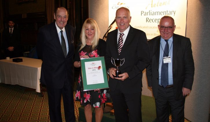 Martin Kinney and Ann Whelan accept the Sites in Bloom award for single couples from Right Honourable Sir Nicholas Soames and Grenville Chambers, Chairman of The Caravan Club