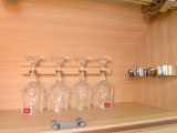 Auto-Sleepers’ signature set of crystal glasses is standard-issue kit – the adjacent clips are for bottles