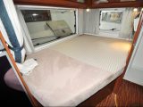 The French bed is set at a low height for ease of access – read more about this and other used motorhomes for sale