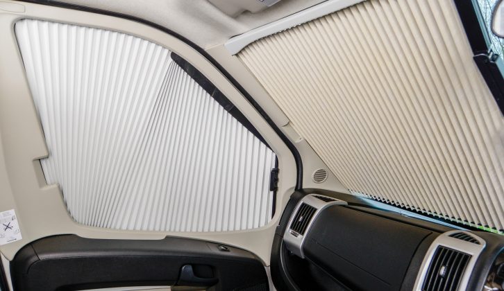 Concertina blinds for the windscreen and cab doors come as standard in the Benimar Mileo 313, and create a good blackout
