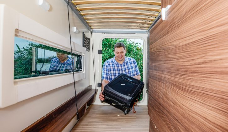 A full-width rear storage compartment – formed by raising the lower bunk – is the next best thing to having a garage