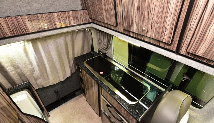 The large overhead lockers in the kitchen have press-button catches – read more in the Practical Motorhome Leisuredrive Vivante LWB review