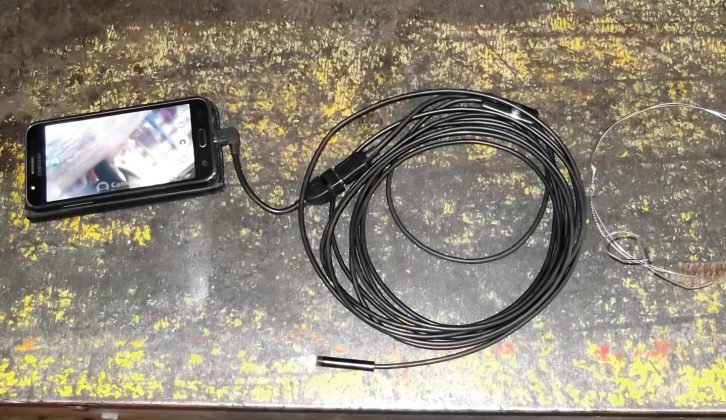 An endoscope camera, a mobile phone and a flue brush were ideal for inspecting and cleaning the issue