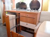 A pull-out shelf in the Eura Mobil's kitchen is ideal for cans and other items you don’t want
to roll around, and there’s a cutlery drawer, too