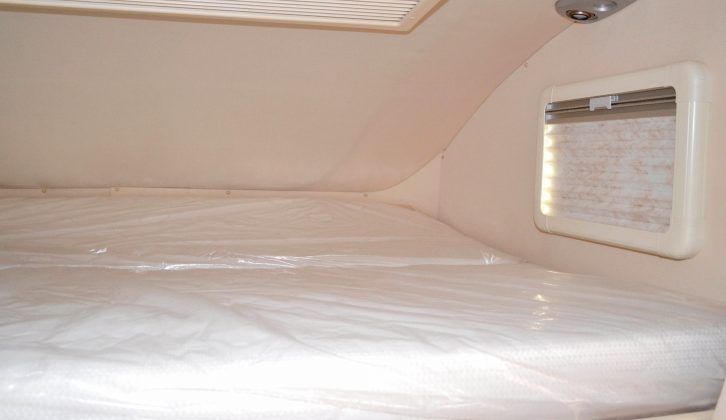 The overcab double bed is large, measuring 2.1 x 1.62m (6'11" x 5'4")