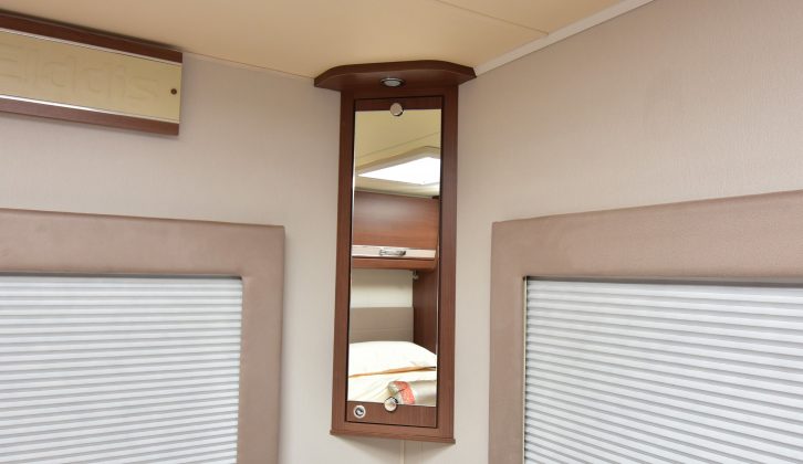 A tall mirror sits above the cupboard in the bedroom – a clever use of space in this Elddis motorhome