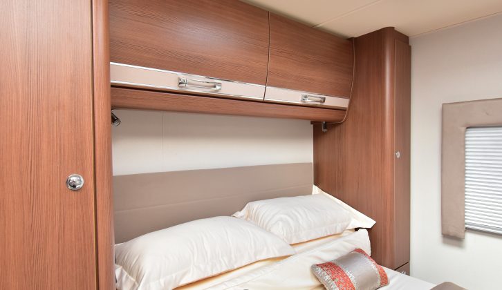 Wardrobes flank the island bed with cupboards above, LED spotlights also fitted – read more in the Practical Motorhome Elddis Encore 254 review