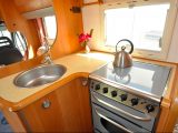 The L-shaped kitchen helps make the most of the available space in this secondhand ’van