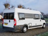 Open the barn doors to let the outside into this motorhome's rear lounge