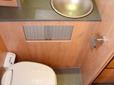 Washroom fittings look very plain, but there aren’t too many compromises, it is well equipped and there's useful storage space behind those tambour doors