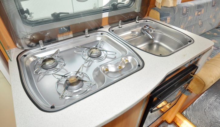 A three-burner hob, a separate sink and another bit of fold-up worktop to the right should keep most cooks happy