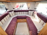 The massive lounge in this Auto-Trail is well lit, thanks to a Midi-Heki, and has plenty of storage options above and below
