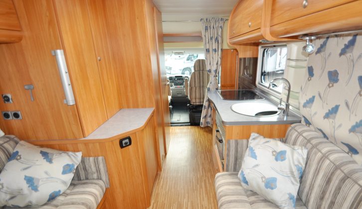 As you can see, the previous owner added a rail and curtains for cutting off the cab, plus drapes for the rear windows and a couple of scatter cushions, all in floral blue
