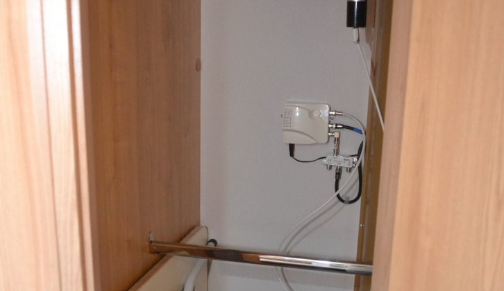 There are two hanging rails in the wardrobe which, when full, might make it tricky to get the freestanding table out