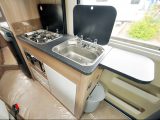 The compact kitchen is a little short of storage, although the waste bin and worktop extension are handy