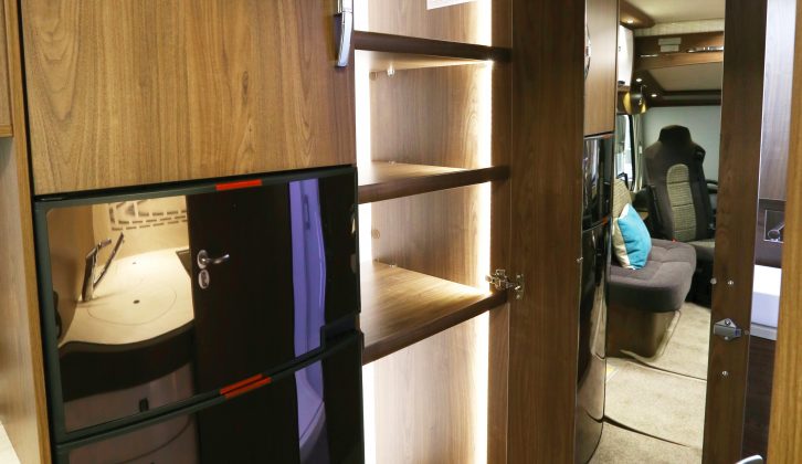 The wardrobe in this motorhome also benefits from a refined lighting solution, while a full-length mirror inside the door is another considerate touch