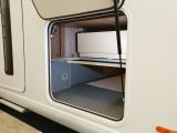 This large storage compartment runs under the lounge right across the ’van, and can be loaded from both sides of the vehicle – it’s heated, too