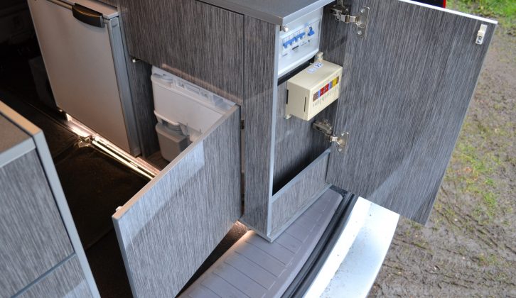 The fridge is opposite the main kitchen, while the fuse panel and main control unit are hidden behind a door at the rear of the offside unit for easy access