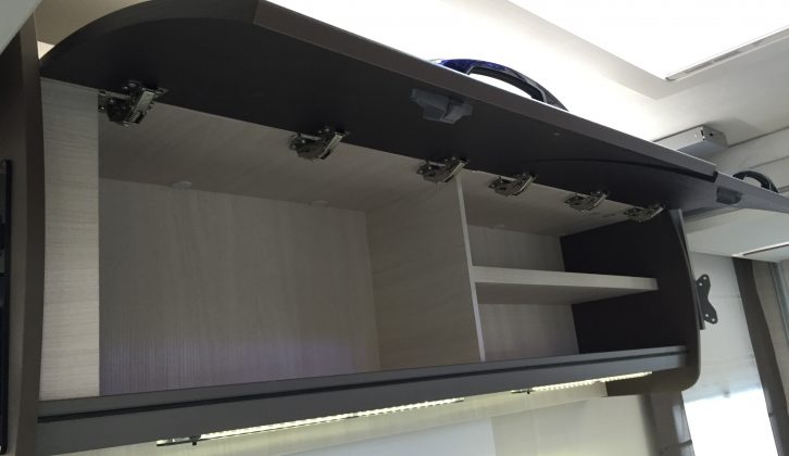 There's some handy overhead kitchen storage, ambient light above a stylish touch