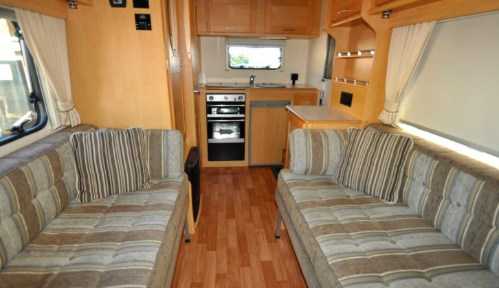The front lounge in this Elddis motorhome has twin settees that can be made into a transverse double bed
