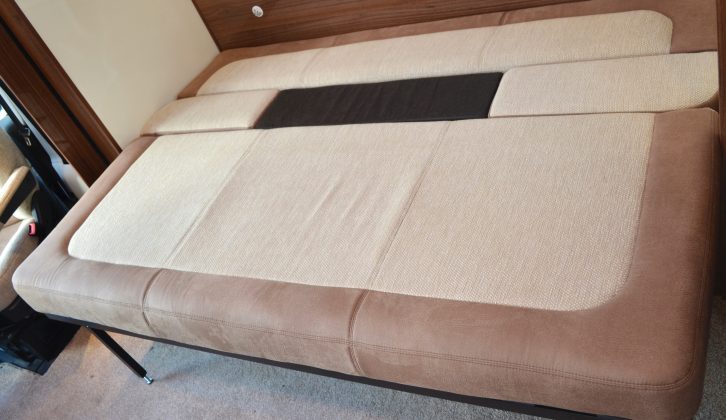 You can make a bed by sliding out the settee, but it’s effectively a transverse bed with only a minimal amount of headboard for two