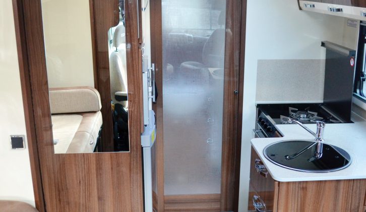 The end washroom is nicely partitioned off from the rest of the motorhome by a frosted door, but you might find it restricts space inside