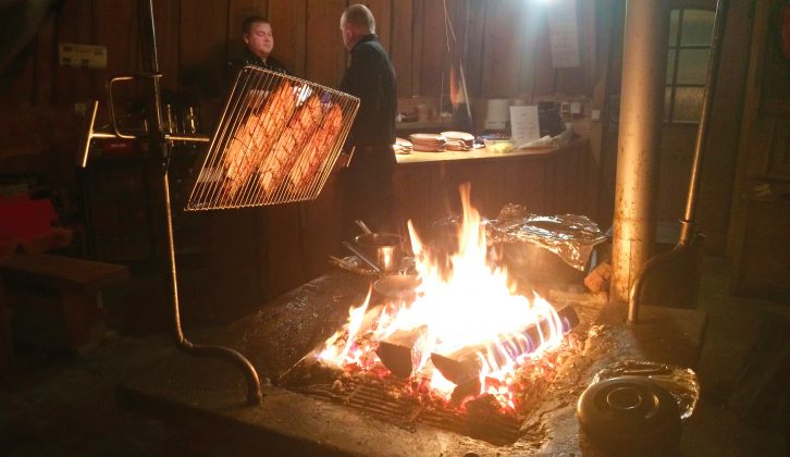 Salmon on the barbecue for a slap-up supper in an authentic Lappish hut