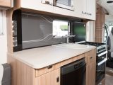 Both the overhead lockers and the cupboards are within easy reach of anyone working in this Swift's central kitchen – it’s well lit, too