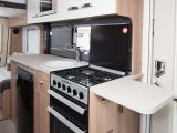 The extension flap adds to what is already a generous amount of workspace in the central kitchen – and it doesn’t get in the way of the door too much